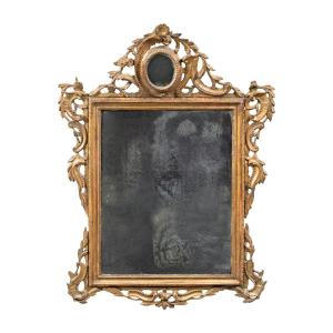 Specchiera in legno intagliato e dorato. Venezia, seconda metà XVIII secolo.
