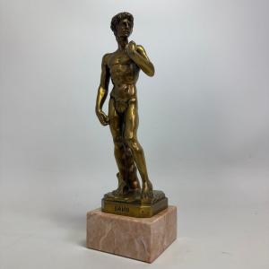 Brass Statue Of David On A Marble Pedestal