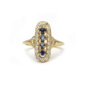 Elegant Halo Ring In 18k Yellow Gold Set With Sapphire And Diamonds