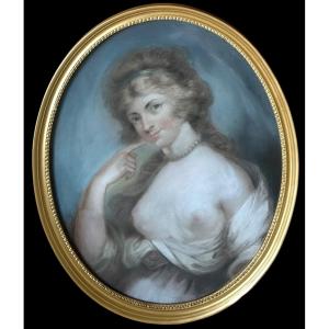 An Early  19th Century French School Oval Portrait Of An Attractive Young Woman