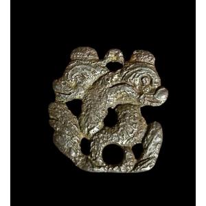 A Pendant With Marine Creatures Resembling Dolphins, 16th Century Or Earlier