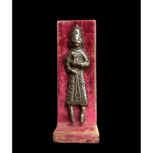 An Embossed And Gilded Copper Figure Holding A Cup, Iran-12th Century