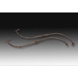 Pair Of Bails. In Iron. 20th Century, After Old Models.